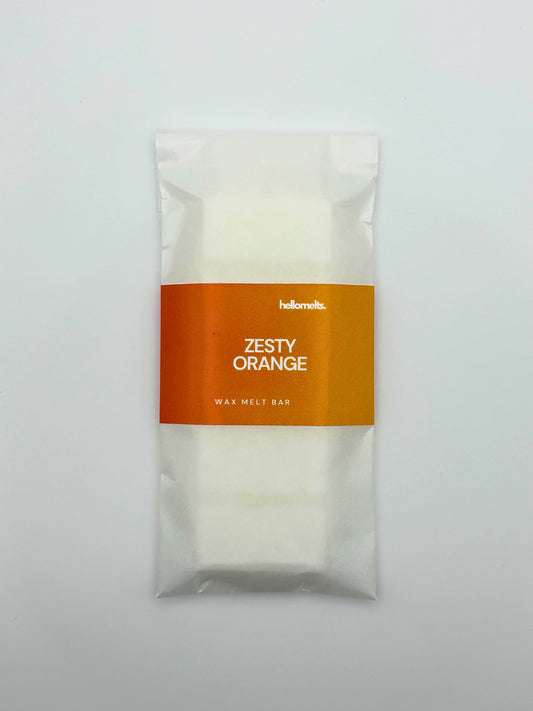 Flatlay top-down view of the Zesty Orange 50g wax melt bar by Hellomelts from the Summer Collection.