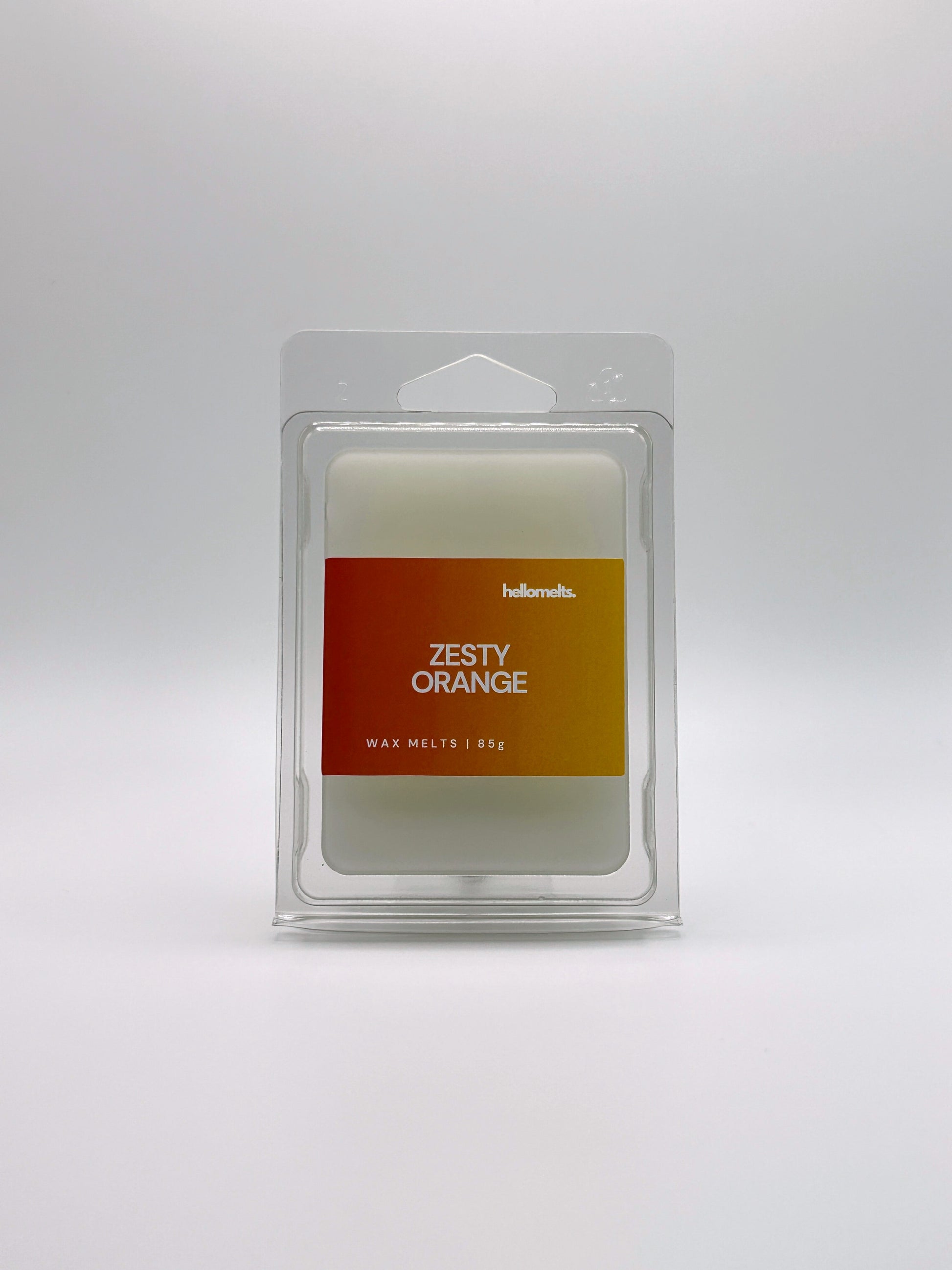 Front-facing view of Hellomelts Zesty Orange 85g wax melt bar from the Summer Collection, featuring bright citrus-themed packaging