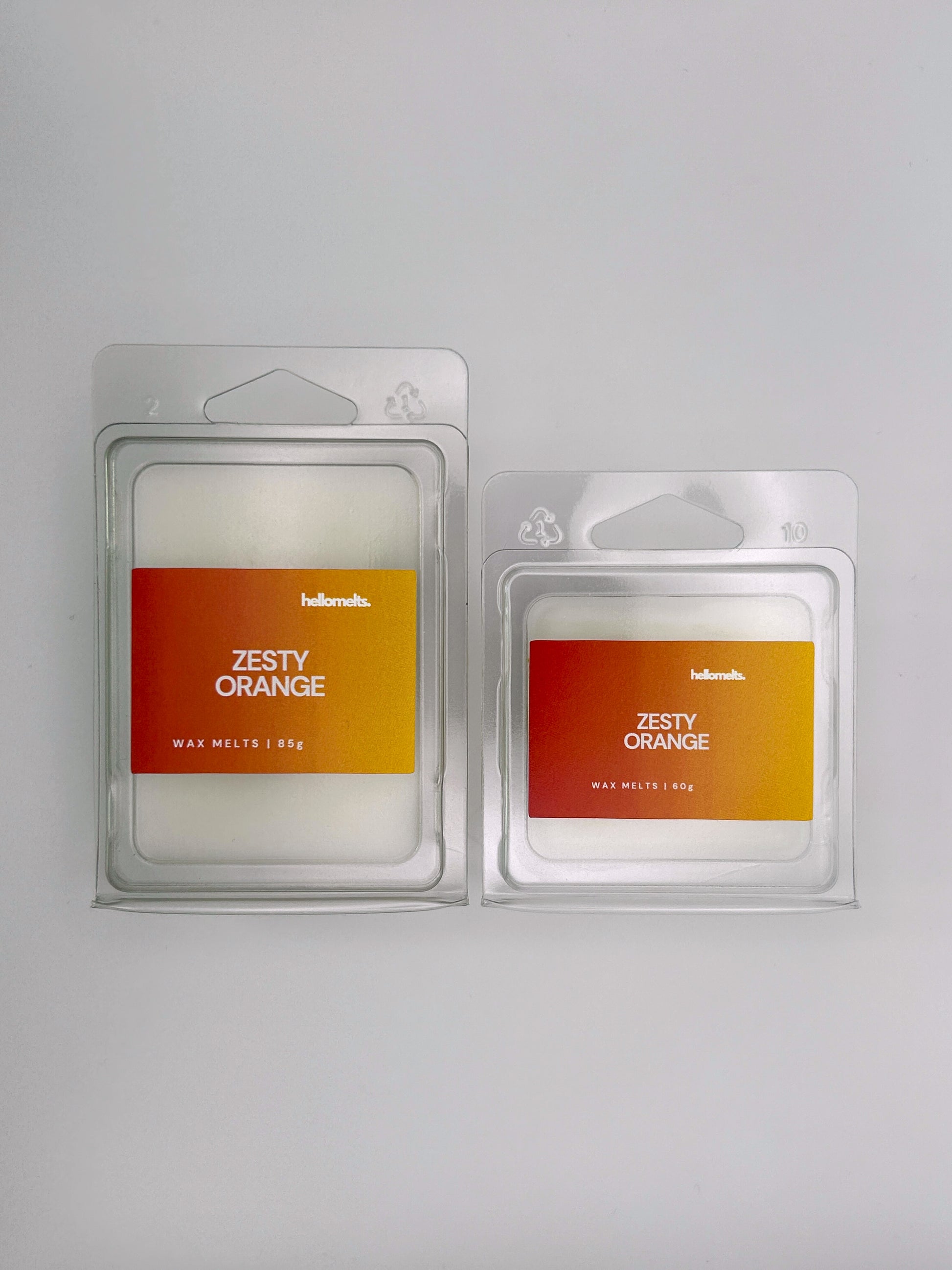 Side-by-side view of Hellomelts Zesty Orange wax melts in both 85g and 60g sizes from the Summer Collection